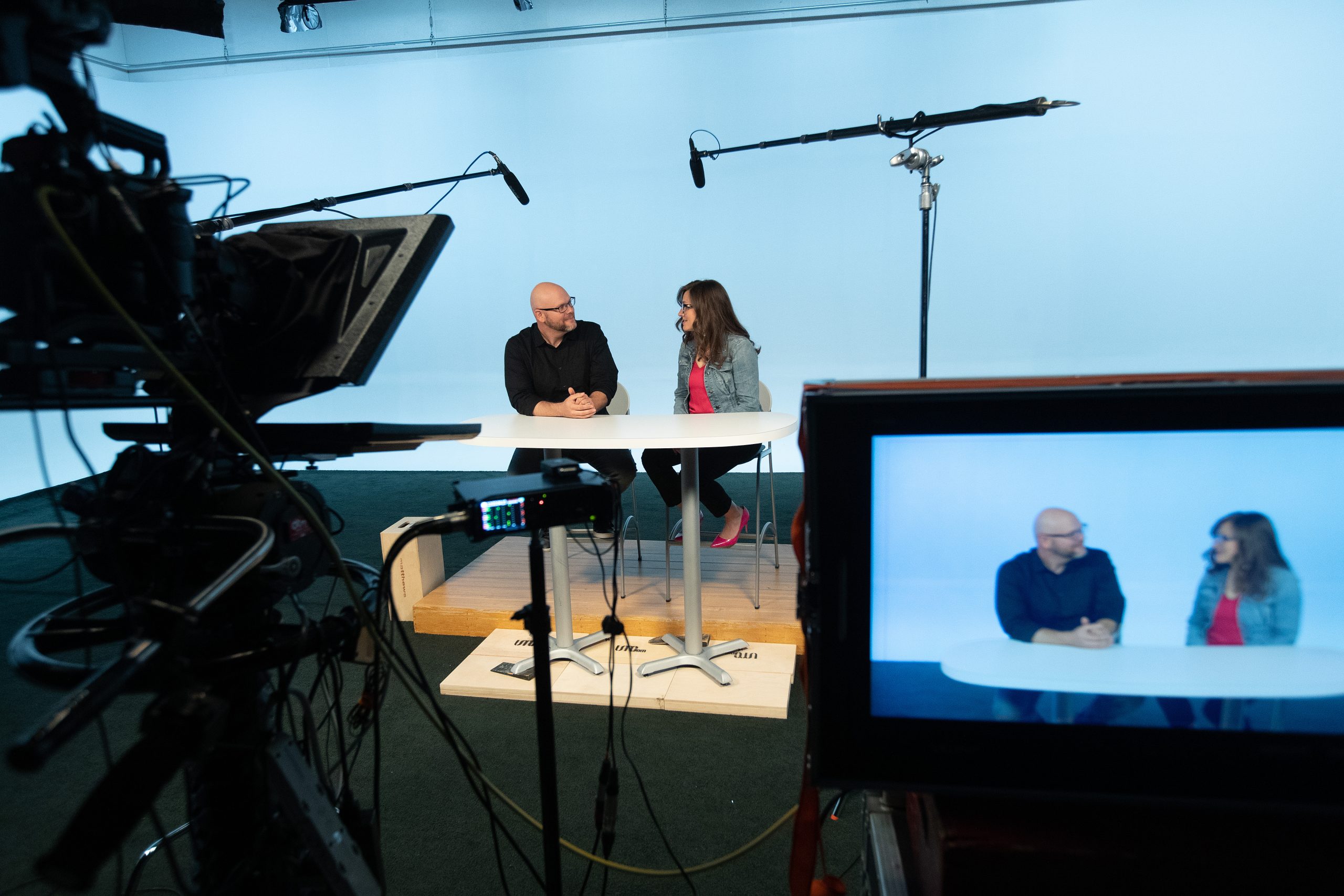 two people on studio set