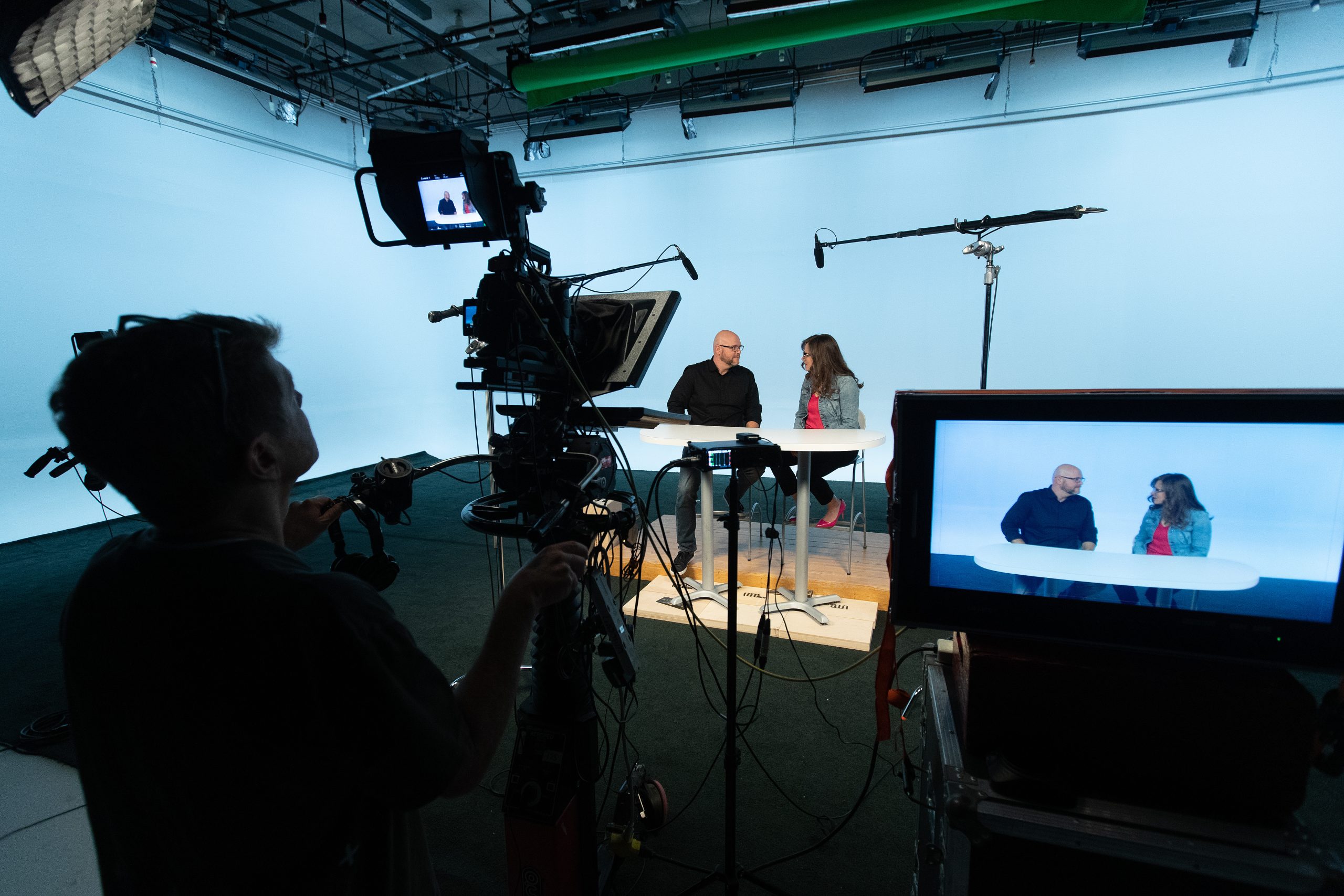 two people on studio set